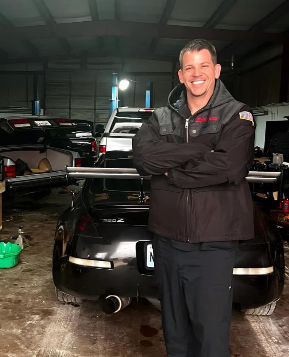 Garrett of Street Fire Automotive Repair standing in the shop
